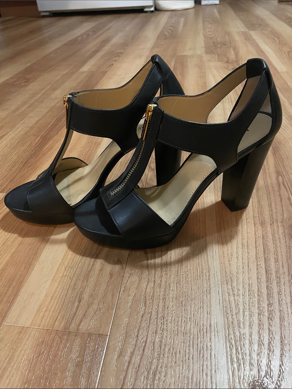 MICHAEL Michael Kors Black Leather T‑Strap Heels with Gold Zip Accent